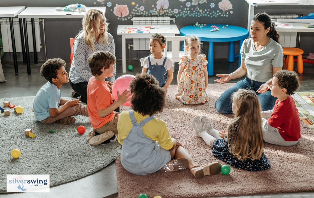 ABA therapists conducting a group therapy session with children