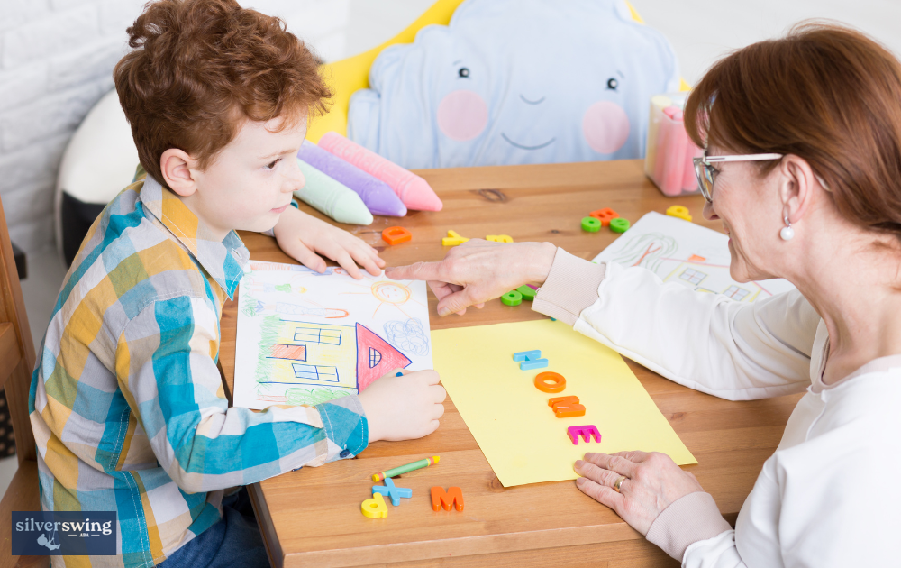 ABA therapist working with a child on a drawing activity