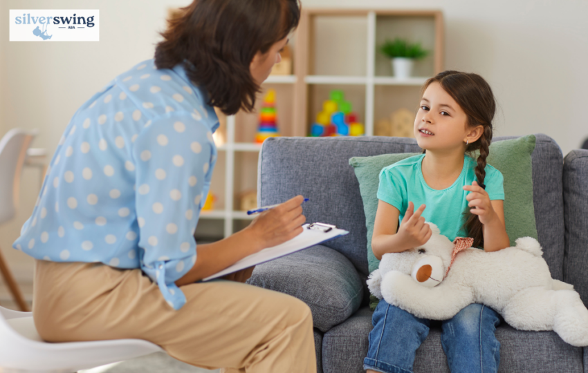 ABA therapist taking session with girl
