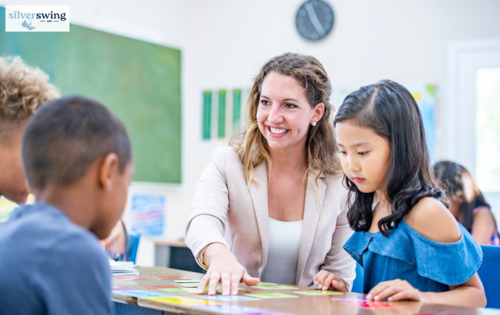ABA therapist engaging with children during a therapy session