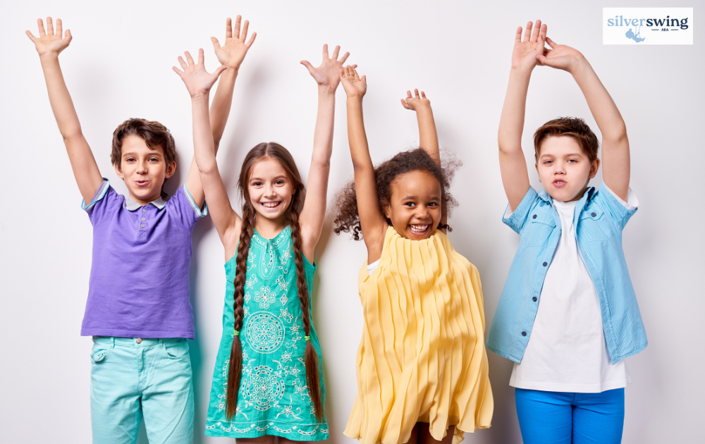 Happy children raising their hands