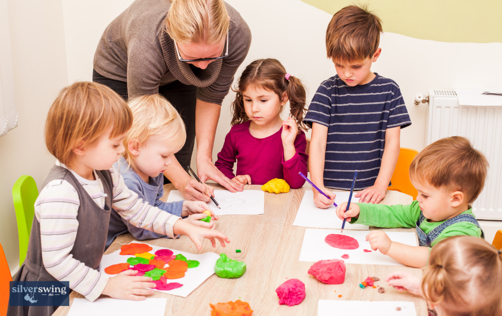 Children engaged in activities with ABA therapist